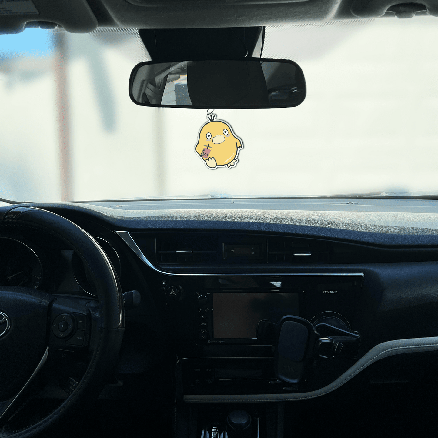 black ice scented design featuring duck holding boba air freshener, decorative hanging car accessory with fragrance.