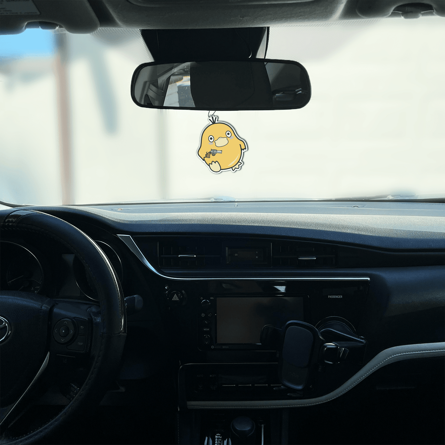 black ice scented design featuring duck holding gun air freshener, decorative hanging car accessory with fragrance.