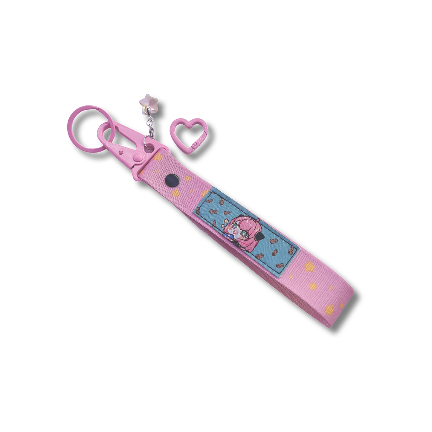 Anya Key Strap is a pink woven key strap with Anya Forger on a patch, with a star charm added and a heart carabiner attachment.
