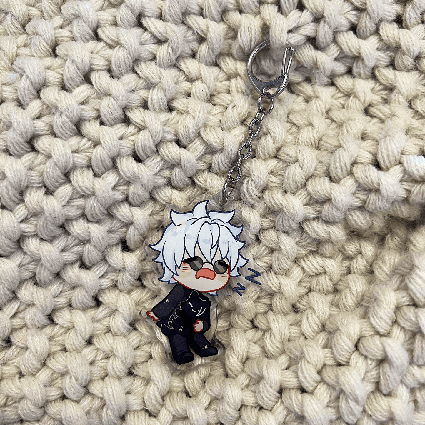 clear acrylic keychain featuring gojo satoru from jujutsu kaisen sleeping holding geto suguru cat