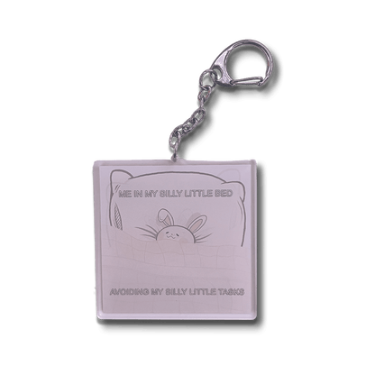 bunny in a bed kawaii acrylic keychain, lightweight charm for keys and bags.