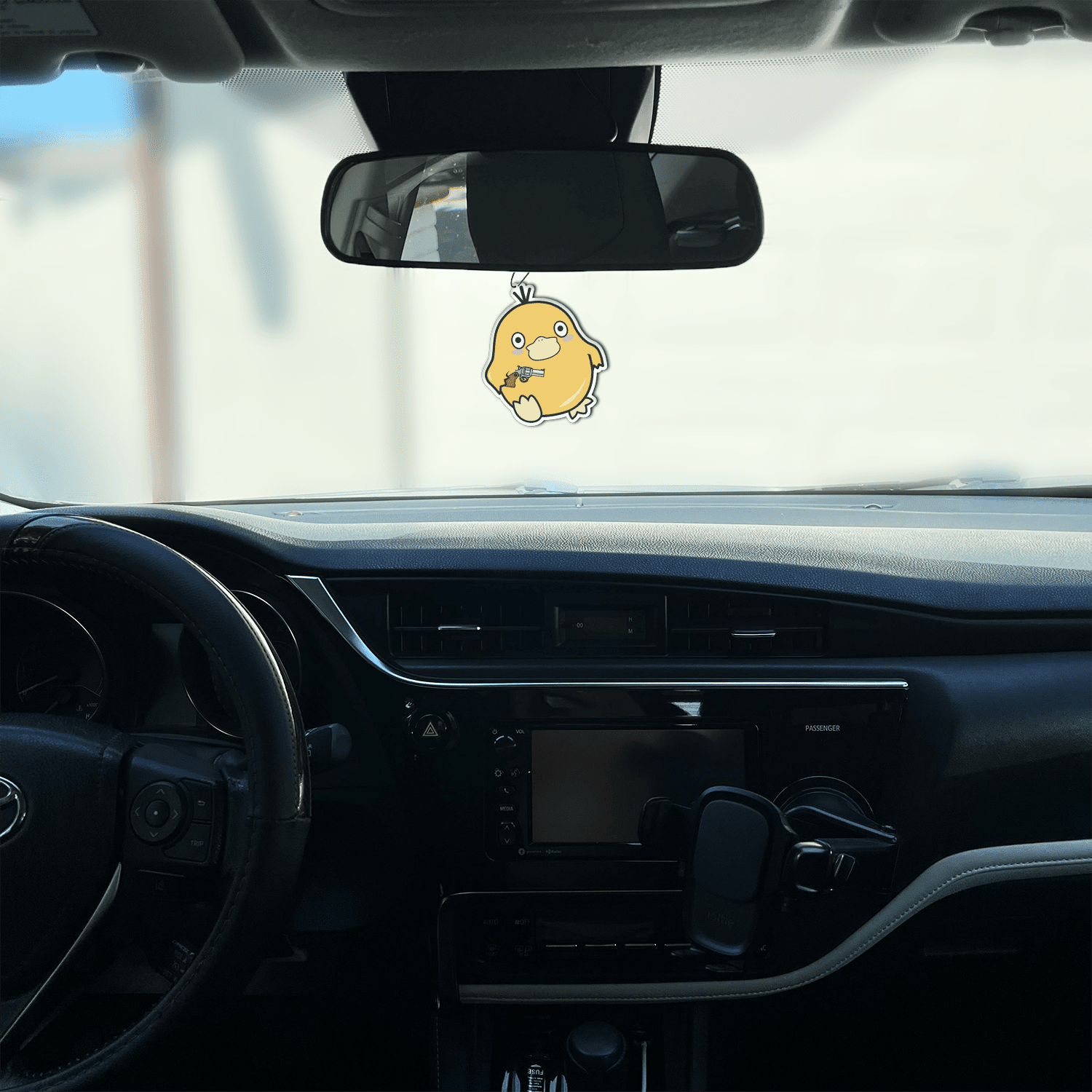 black ice scented design featuring duck holding gun air freshener, decorative hanging car accessory with fragrance.
