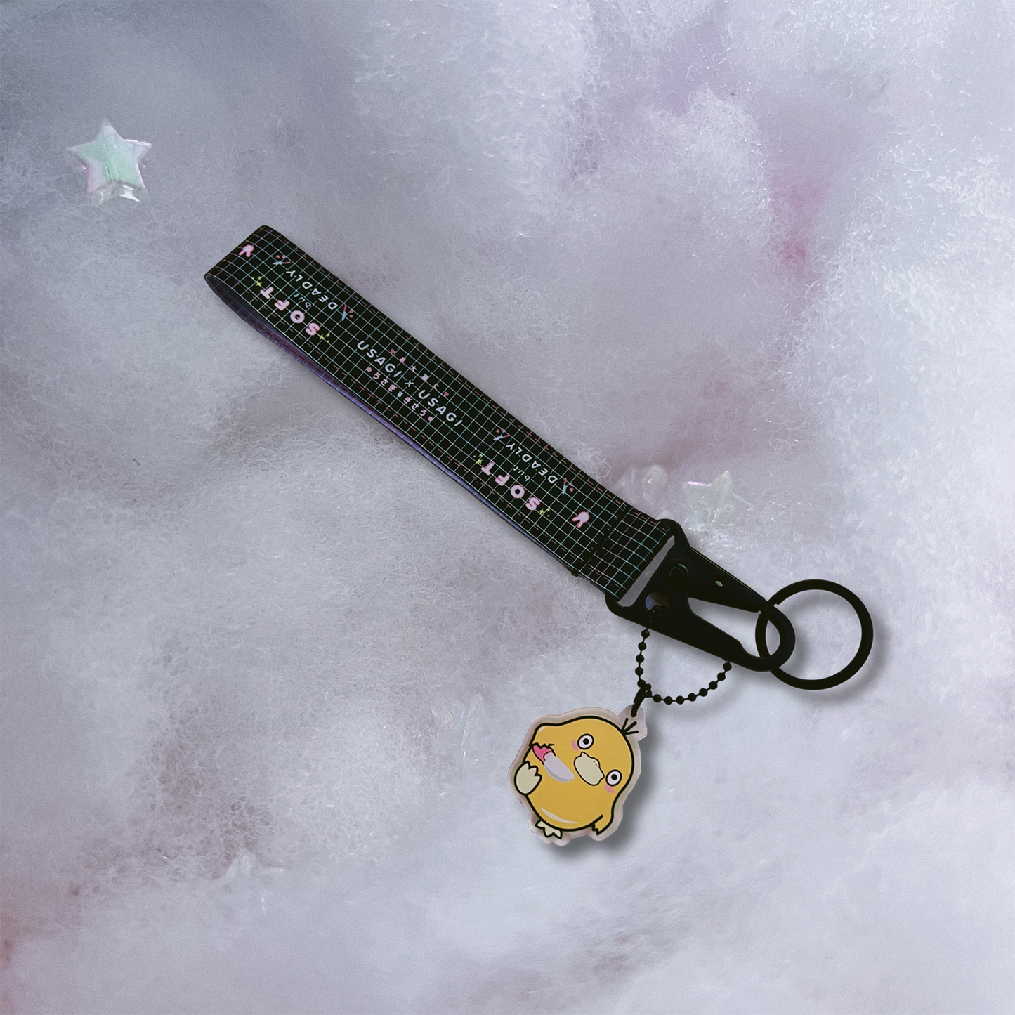 Duck with Knife Key Strap includes black strap with "Soft but deadly," text and Usagi x Usagi logo. Attached is a acrylic charm of Psyduck with Knife.