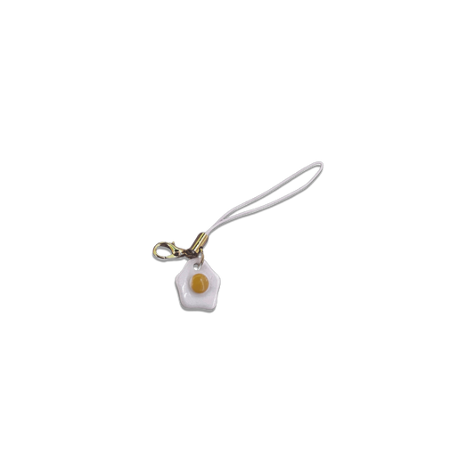 Small egg charm on a basic white phone strap.