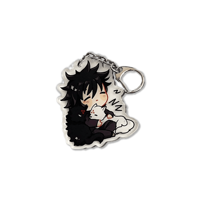 clear acrylic keychain featuring megumi fushiguro from jujutsu kaisen sleeping hugging black and white shikigami puppies