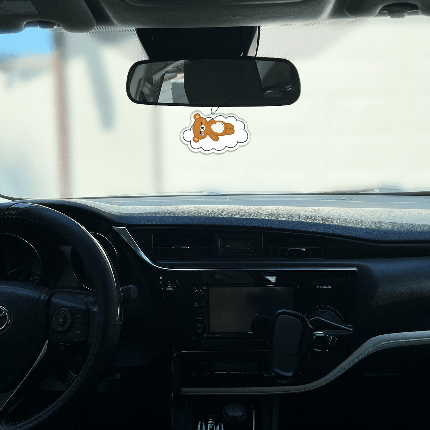 honeydew scented design featuring sleeping bear on a cloud air freshener, decorative hanging car accessory with fragrance.