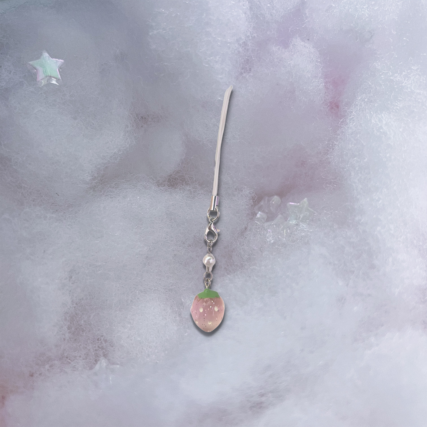 Small light pink strawberry charm with pearlescent bead and basic light pink phone strap.