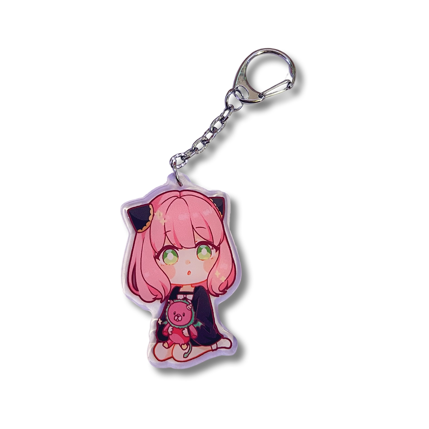 Anya Plushie Keychain design features Anya Forger from Spy x Family holding a chimera plushie in a sitting position.