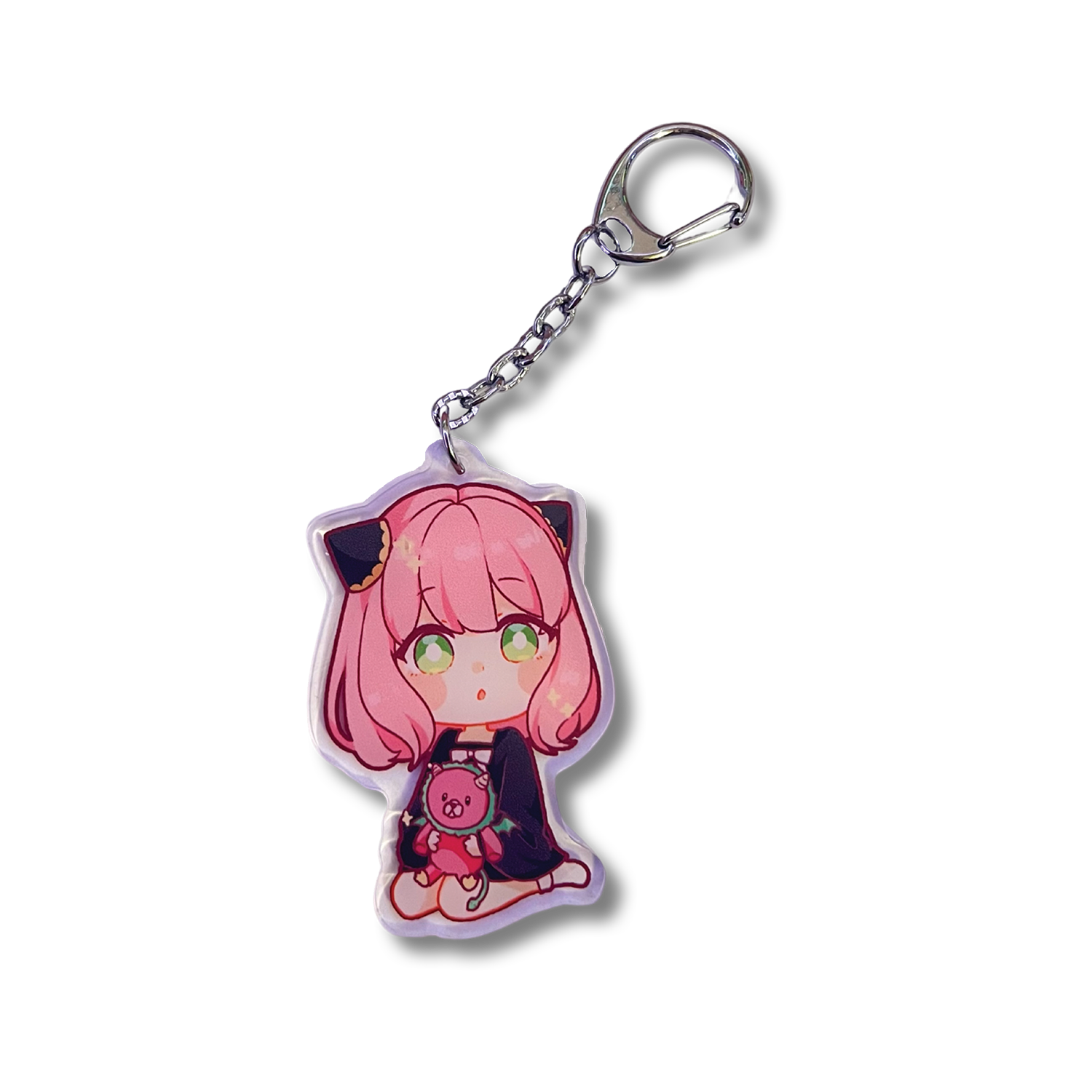 Anya Plushie Keychain design features Anya Forger from Spy x Family holding a chimera plushie in a sitting position.