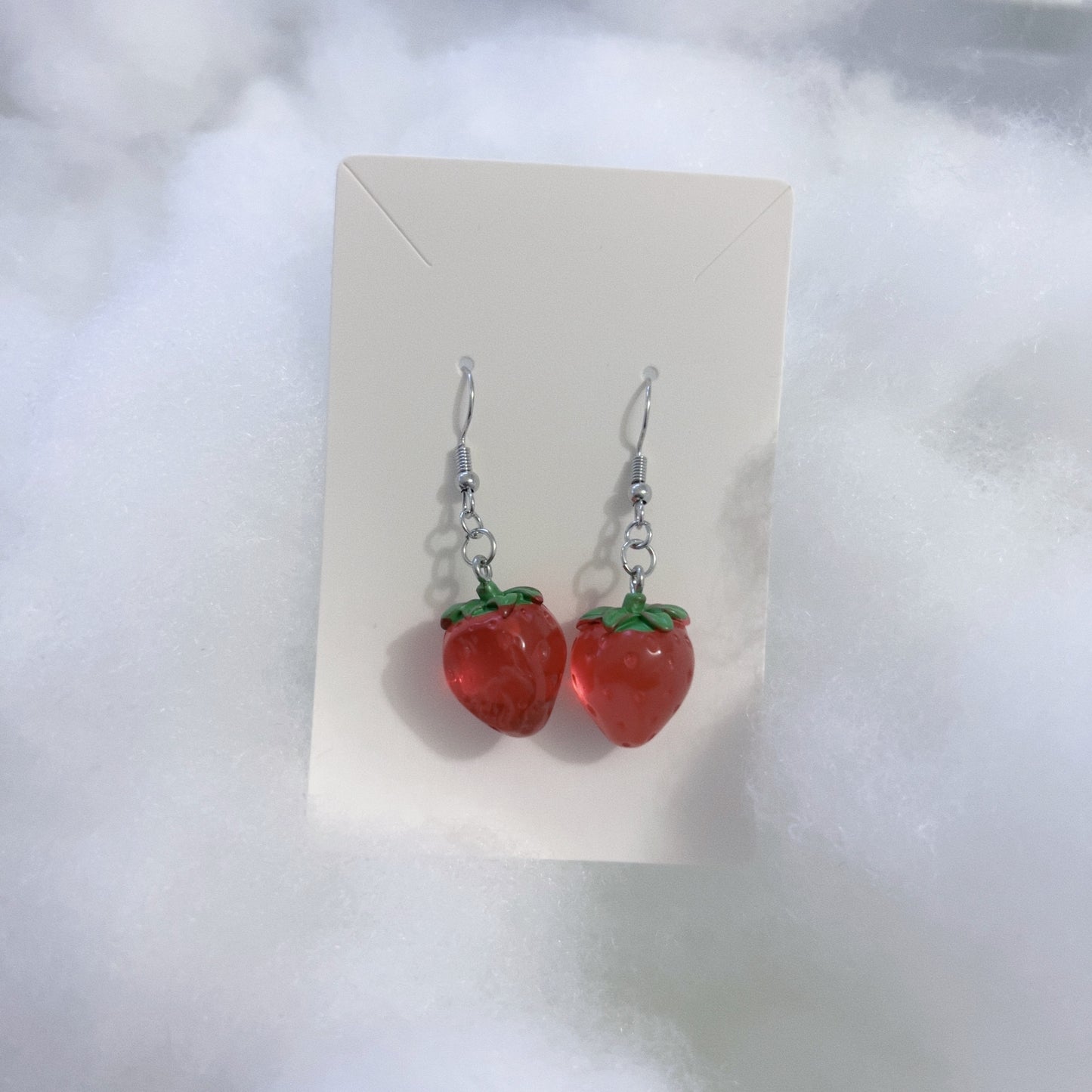 Big strawberry earrings.