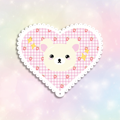White Bear Sticker design is a white bear inside a pink lace-scalloped heart with yellow sparkles.