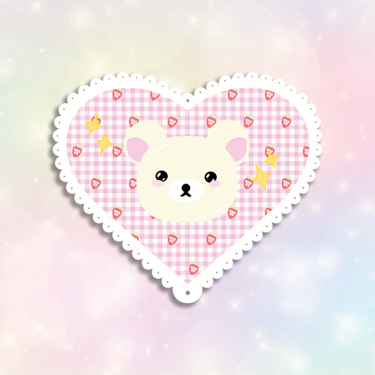 White Bear Sticker design is a white bear inside a pink lace-scalloped heart with yellow sparkles.
